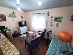 Casa com 03 dormitórios e terreno com 900m² no bairro Costa do Morro 