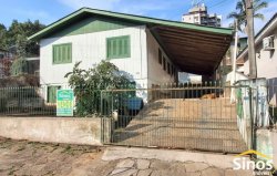 Terreno com construção no bairro Vila Nova 
