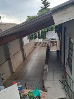 Terreno com construção no bairro Vila Nova 