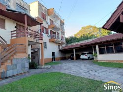 Terreno de esquina com 1.900m² com construção no bairro Ouro Branco 