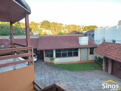 Terreno de esquina com 1.900m² com construção no bairro Ouro Branco 