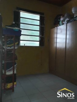 Terreno com 02 Imóveis na Scharlau 