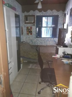 Terreno com 02 Imóveis na Scharlau 