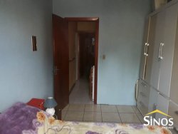 Terreno com 02 Imóveis na Scharlau 