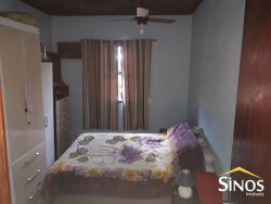 Terreno com 02 Imóveis na Scharlau 