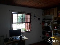 Terreno com 02 Imóveis na Scharlau 