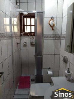Casa de alvenaria com três dormitórios  