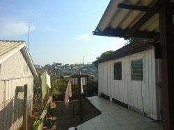 Terreno com 02 casas no Ideal 