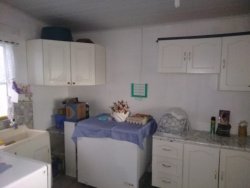 Terreno com 02 casas no Ideal 