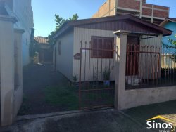 Terreno com 02 casas no bairro Rondônia 