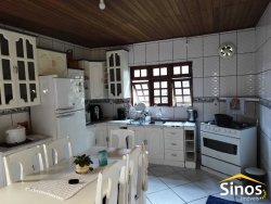 Terreno plano com duas casas no Bairro Canudos 
