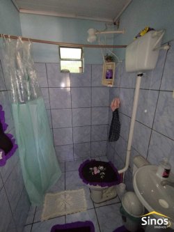 Terreno plano com duas casas no Bairro Canudos 
