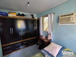 Terreno plano com duas casas no Bairro Canudos 