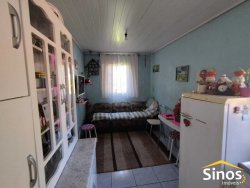 Terreno plano com duas casas no Bairro Canudos 