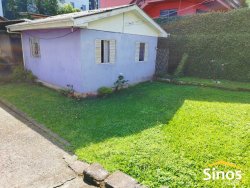 Terreno plano com duas casas no Bairro Canudos 