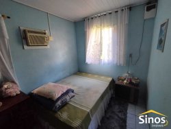 Terreno plano com duas casas no Bairro Canudos 