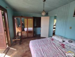 Terreno com duas casas no bairro Vila Nova 