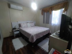 Terreno de 436,26m² com casa no bairro Rondônia  