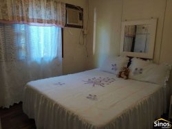 Terreno de 436,26m² com casa no bairro Rondônia  
