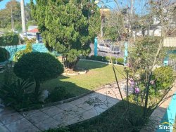 Casa com 03 dormitórios e prédio comercial no bairro Rondônia  