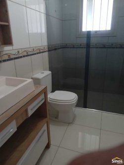 Casa com 03 dormitórios e prédio comercial no bairro Rondônia  