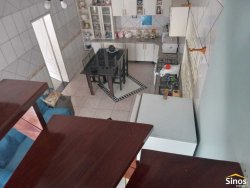 Casa com 03 dormitórios e prédio comercial no bairro Rondônia  