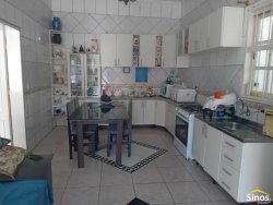 Casa com 03 dormitórios e prédio comercial no bairro Rondônia  
