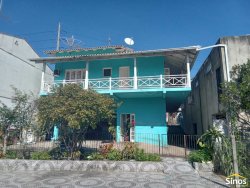 Casa com 03 dormitórios e prédio comercial no bairro Rondônia  