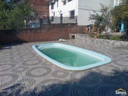 Casa com 03 dormitórios e prédio comercial no bairro Rondônia  