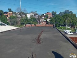 Casa com 03 dormitórios e prédio comercial no bairro Rondônia  