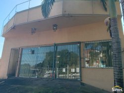 Casa com 03 dormitórios e prédio comercial no bairro Rondônia  