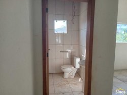 Casa com 03 dormitórios e prédio comercial no bairro Rondônia  