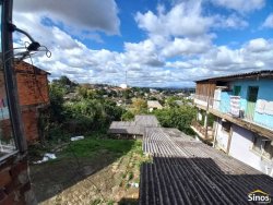 Terreno com casa no bairro Rondônia  