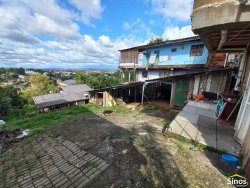 Terreno com casa no bairro Rondônia  