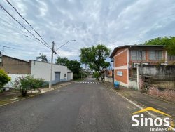 Terreno com construção no bairro Vila Nova 