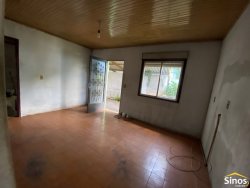 Terreno com construção no bairro Vila Nova 