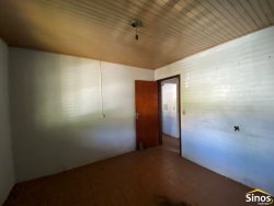 Terreno com construção no bairro Vila Nova 