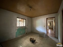 Terreno com construção no bairro Vila Nova 