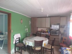 Terreno com 02 casas no bairro Lomba Grande 