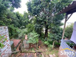 Terreno com construção no bairro Rondônia 