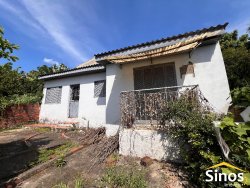 Terreno com 02 casas no bairro Guarani 