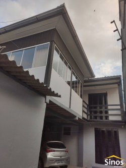 Terreno com 02 casas no bairro Canudos 