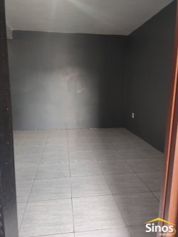 Terreno com 02 casas no bairro Canudos 