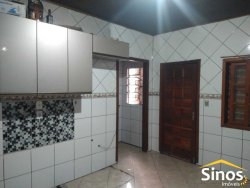 Terreno com 02 casas no bairro Lomba Grande 