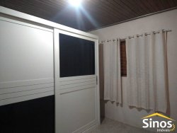 Terreno com 02 casas no bairro Lomba Grande 