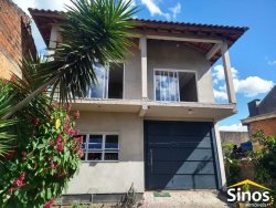 Terreno com 02 casas no bairro Lomba Grande 