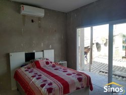 Terreno com 02 casas no bairro Lomba Grande 