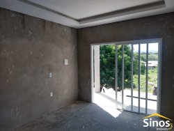 Terreno com 02 casas no bairro Lomba Grande 