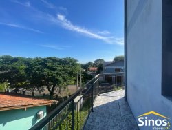 Prédio com apartamento e salas comerciais no bairro Lomba Grande  