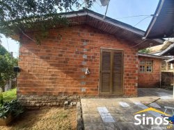 Terreno com 02 casas e sala comercial no bairro Guarani 